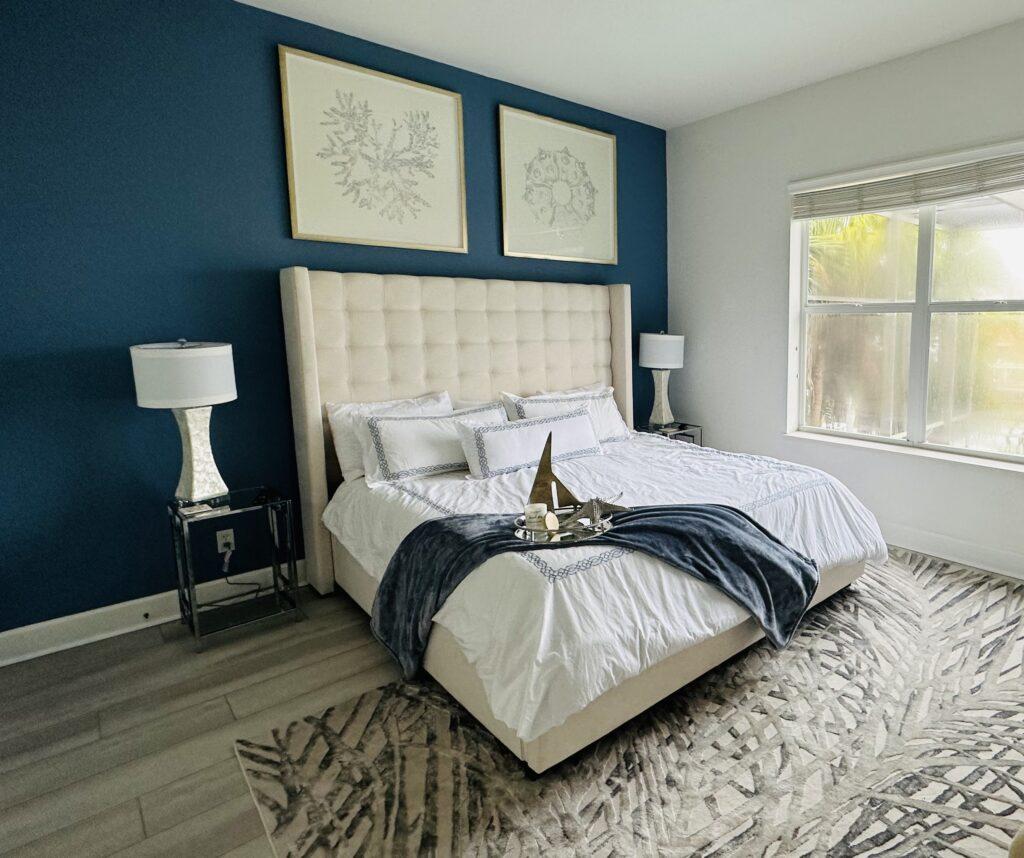 Guest bedroom in Naples Florida with accent wall designed by OTW Interiors