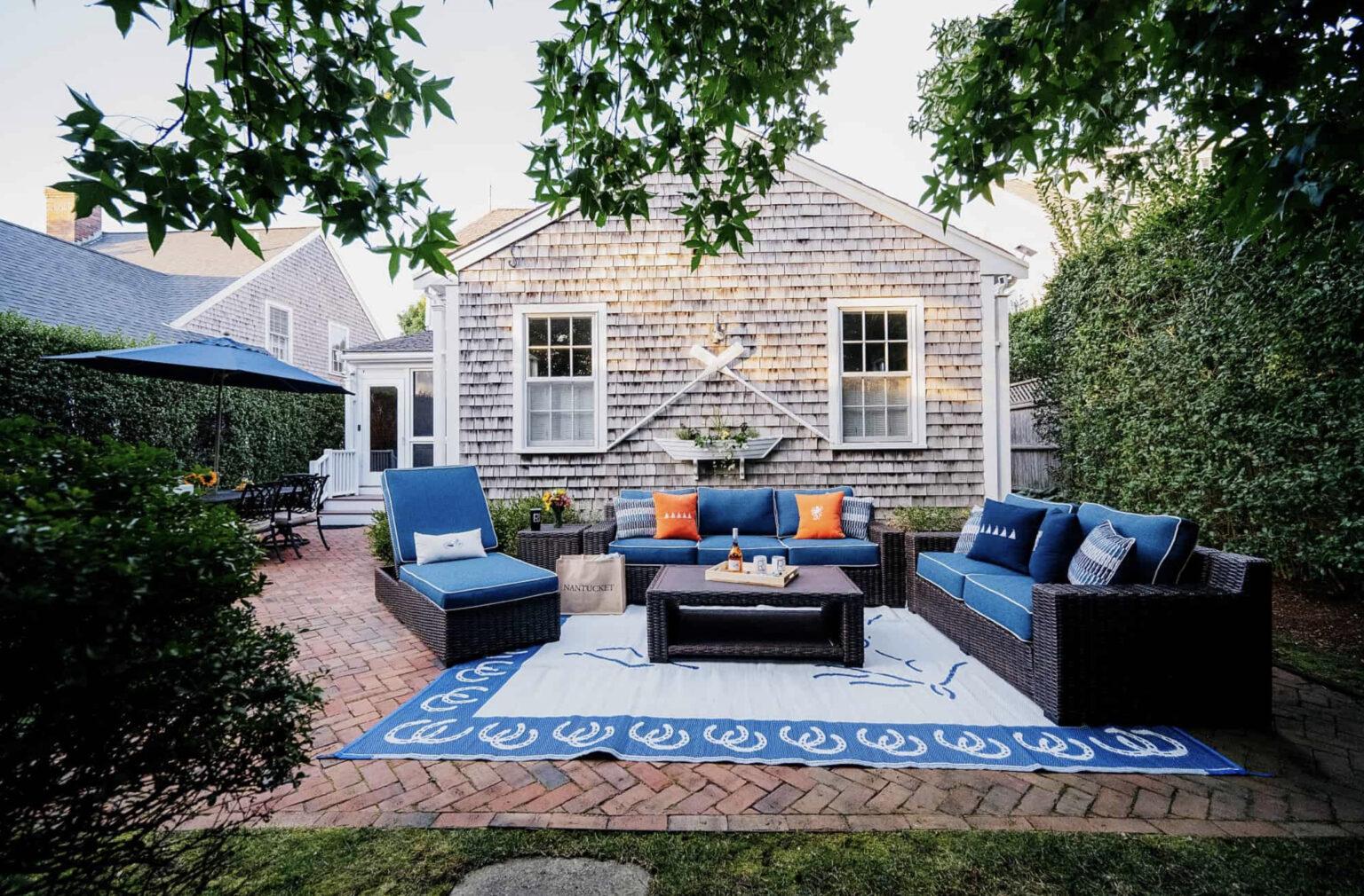 Nautical outdoor living space with orange accent color nantucket Massachusetts